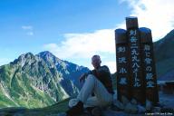 Me by Tsurugizawa cabin with Mt. Tsurugi in the background.