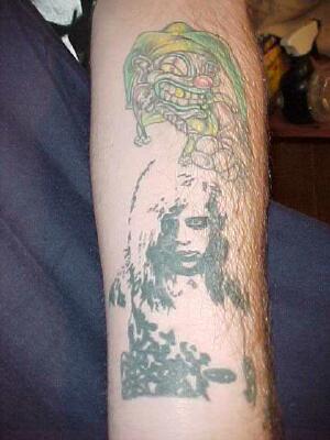 A shot of a Dawn of the Dead tattoo etched on the arm of TZF reader 